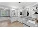 Bathroom featuring granite counters, white cabinets, dual sinks, bath, and stylish light fixtures at 4250 Green Ridge Dr, Marietta, GA 30062
