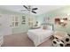 Bright bedroom with a ceiling fan, white bedding, and neutral carpet, creating a cozy and inviting space at 4250 Green Ridge Dr, Marietta, GA 30062