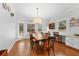 Bright dining room with hardwood floors, a wooden table, and a light fixture at 4250 Green Ridge Dr, Marietta, GA 30062