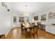 Bright dining room with hardwood floors, a large wooden table, and built-in cabinets at 4250 Green Ridge Dr, Marietta, GA 30062