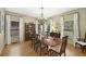 Traditional dining room featuring hardwood floors, a chandelier, and natural light from the windows at 4250 Green Ridge Dr, Marietta, GA 30062