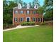Charming brick two-story home featuring a well-manicured lawn and inviting walkway at 4250 Green Ridge Dr, Marietta, GA 30062