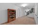 Hallway features a bookshelf and staircase, creating a functional and stylish space at 4250 Green Ridge Dr, Marietta, GA 30062