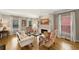 Bright living room with a marble fireplace, hardwood floors, and ample natural light from the windows at 4250 Green Ridge Dr, Marietta, GA 30062