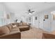 Spacious living room with a large sectional sofa, fan, and neutral walls, creating a relaxing and inviting atmosphere at 4250 Green Ridge Dr, Marietta, GA 30062