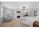Bright main bedroom features a fireplace, a TV, chair, a ceiling fan and a double window providing natural light at 4250 Green Ridge Dr, Marietta, GA 30062