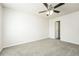 Spacious bedroom featuring plush carpet, ceiling fan, and neutral walls at 6481 Alford Way, Lithonia, GA 30058