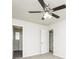 Cozy bedroom featuring a ceiling fan, carpet flooring, and white walls at 6481 Alford Way, Lithonia, GA 30058