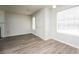 Bright living room featuring a large window, and modern floors at 6481 Alford Way, Lithonia, GA 30058
