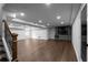 Finished basement with bar, recessed lighting, and sleek flooring at 7110 Northgreen Dr, Atlanta, GA 30328