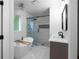 Bright bathroom featuring a freestanding tub, a glass shower, and modern vanity at 7110 Northgreen Dr, Atlanta, GA 30328