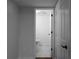 A half bathroom featuring tile flooring and a modern toilet, conveniently located near other rooms at 7110 Northgreen Dr, Atlanta, GA 30328