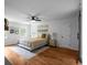 Spacious bedroom featuring hardwood floors, a ceiling fan, neutral paint, and bright natural light at 7110 Northgreen Dr, Atlanta, GA 30328