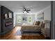 Stylish bedroom with hardwood floors, modern fireplace, and neutral paint creates a relaxing retreat at 7110 Northgreen Dr, Atlanta, GA 30328
