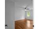 Bright bedroom with hardwood floors, a ceiling fan, and neutral paint at 7110 Northgreen Dr, Atlanta, GA 30328