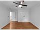 Bedroom with hardwood floors, a window, closet and a ceiling fan at 7110 Northgreen Dr, Atlanta, GA 30328