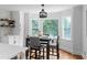 Breakfast nook features a dining table with four chairs and bright windows at 7110 Northgreen Dr, Atlanta, GA 30328