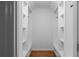 Well-organized walk-in closet with custom shelving and drawers for ample storage at 7110 Northgreen Dr, Atlanta, GA 30328