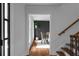 Elegant dining room with modern decor, a stylish light fixture, and a view into the hallway at 7110 Northgreen Dr, Atlanta, GA 30328