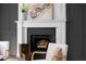 Close up on fireplace with marble hearth and mantel, flanked by dark walls at 7110 Northgreen Dr, Atlanta, GA 30328