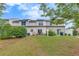 View of back of home with a grassy backyard with some shrubbery and fencing at 2336 Heritage Park Nw Cir # 11, Kennesaw, GA 30144