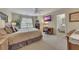 Spacious bedroom with a large window, TV, and an adjoining bathroom at 2336 Heritage Park Nw Cir # 11, Kennesaw, GA 30144