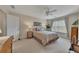 Cozy bedroom featuring a comfortable queen-sized bed, soft lighting, and a window view at 2336 Heritage Park Nw Cir # 11, Kennesaw, GA 30144