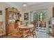 Bright dining area featuring a wooden table, a glass door and pretty backyard view at 2336 Heritage Park Nw Cir # 11, Kennesaw, GA 30144