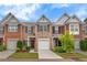 Charming brick townhome with a one-car garage and well-manicured front yard at 2336 Heritage Park Nw Cir # 11, Kennesaw, GA 30144