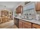 Kitchen space with stainless steel sink, marble countertops, window, and wood cabinets at 2336 Heritage Park Nw Cir # 11, Kennesaw, GA 30144