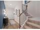 Elegant entryway with hardwood floors, staircase, console table, and decor at 33 Cedar Dr, Fairburn, GA 30213