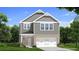 Charming two-story home featuring stone accents, a two-car garage, and a welcoming front porch at 33 Cedar Dr, Fairburn, GA 30213