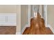 A view of the hallway with hardwood flooring and white trim at 3810 Baverton Dr, Suwanee, GA 30024