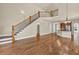 Spacious open-concept living area with hardwood floors and staircase at 3810 Baverton Dr, Suwanee, GA 30024