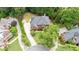 Aerial view showcasing the home's well-manicured lawn, driveway, and landscaping at 130 Silver Mist Cir, Alpharetta, GA 30022