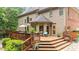 Multi-level back deck and backyard exterior, complete with landscaping at 130 Silver Mist Cir, Alpharetta, GA 30022