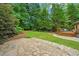 Spacious backyard features a stone patio and deck area, perfect for entertaining or relaxing in the outdoors at 130 Silver Mist Cir, Alpharetta, GA 30022