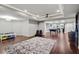 Spacious finished basement with multiple recreational areas and recessed lighting at 130 Silver Mist Cir, Alpharetta, GA 30022