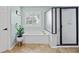 Bathroom featuring a soaking tub, walk-in shower, and neutral-colored tiling at 130 Silver Mist Cir, Alpharetta, GA 30022