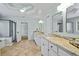 Bathroom featuring double sinks, granite countertops, and a tiled shower with glass doors at 130 Silver Mist Cir, Alpharetta, GA 30022