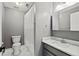 Neutral bathroom features a walk-in shower with shower curtain and modern vanity at 130 Silver Mist Cir, Alpharetta, GA 30022
