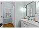 Modern bathroom with a matte black faucet, mirror, and classic white vanity at 130 Silver Mist Cir, Alpharetta, GA 30022