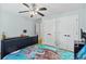 Spacious bedroom with ample closet space, features a ceiling fan and neutral wall color at 130 Silver Mist Cir, Alpharetta, GA 30022