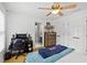 Bedroom with ceiling fan, a window that provides natural light, and a desk for study at 130 Silver Mist Cir, Alpharetta, GA 30022