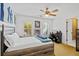 Bedroom with ceiling fan, a window that provides natural light, and a desk for study at 130 Silver Mist Cir, Alpharetta, GA 30022