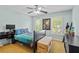 Bright bedroom features a ceiling fan, and natural light with charming dinosaur-themed decor at 130 Silver Mist Cir, Alpharetta, GA 30022