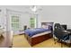 Bedroom with storage under the bed, natural light and dedicated desk space at 130 Silver Mist Cir, Alpharetta, GA 30022