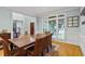 Elegant dining room with a large window, hardwood floors, and traditional decor at 130 Silver Mist Cir, Alpharetta, GA 30022