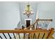 Beautiful foyer featuring a decorative chandelier, wooden staircase, and dark wood front door at 130 Silver Mist Cir, Alpharetta, GA 30022