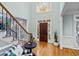 Grand foyer with hardwood floors, staircase, and natural light at 130 Silver Mist Cir, Alpharetta, GA 30022